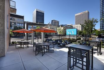 Outdoor patio seating with city skyline views
